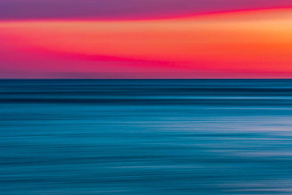 Image of Fire and Ice Fine Art Print featuring a beautiful pink, purple, yellow and blue Hawaiian sunset
